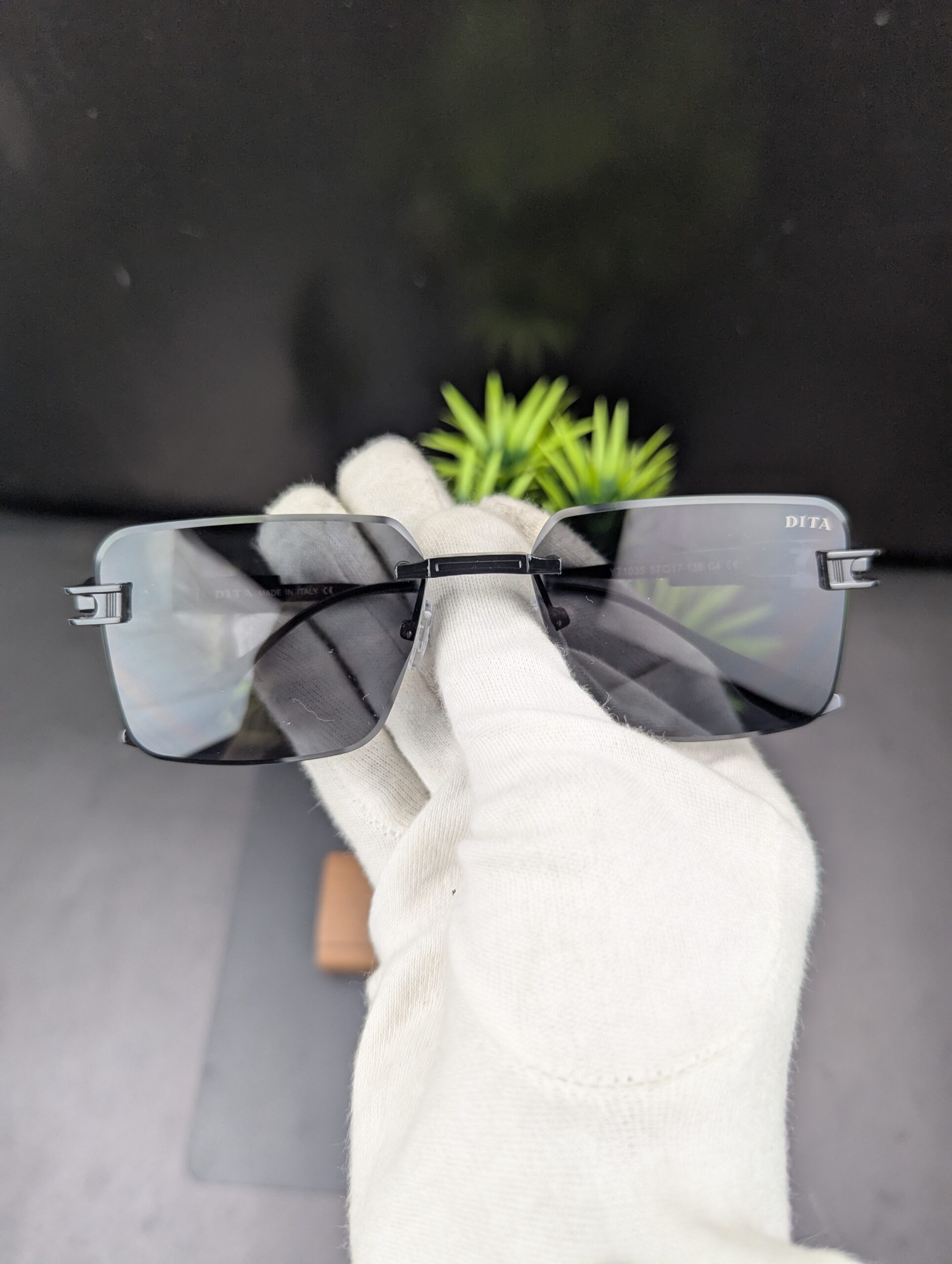 Modern All-Black Rimless Rectangular Sunglasses – Matte Black Metal Temples with Dark Tint Lenses - Image 2