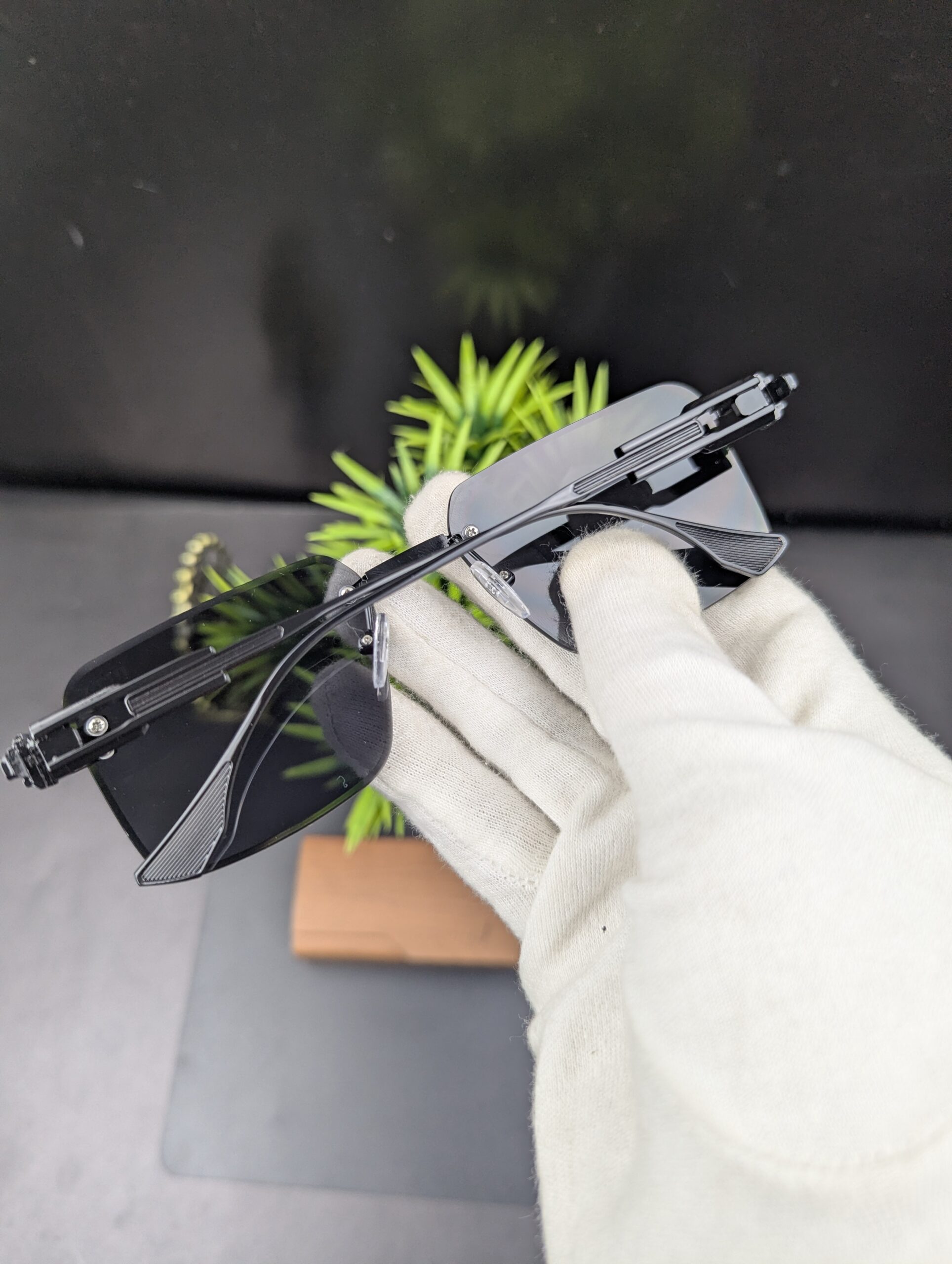 Modern All-Black Rimless Rectangular Sunglasses – Matte Black Metal Temples with Dark Tint Lenses - Image 3
